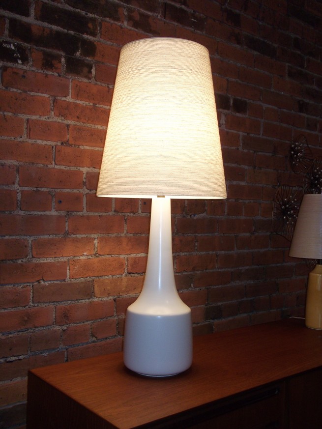 Outstanding pair of Mid-century white ceramic lamps by Lotte & Gunnar Bostlund - all original including their fiberglass shades - excellent vintage condition - these beauties stand - 35"tall- $700/pair