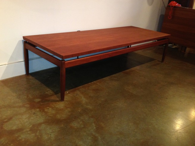 Outstanding Mid-century Modern teak coffee table by famous Danish company France & Son Designed by Finn Juhl or Grete Jalk ( the Jury is out as to who designed it ) -Made in Denmark - incredibly large table with brass details - 68.75"L x 26"D x 16"H - (SOLD)