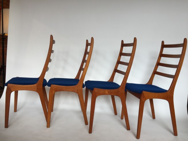 Incredible Set of 4 high back dining chairs - Designed by Kai Kristiansen - Made in Denmark - newly re-finished solid teak curved frames - the contoured backs make for a comfortable back rest - try them out - the seats have a gorgeous deep blue fabric that are clean and usable or you could re-do to suit your style easily :) - $1500/Set