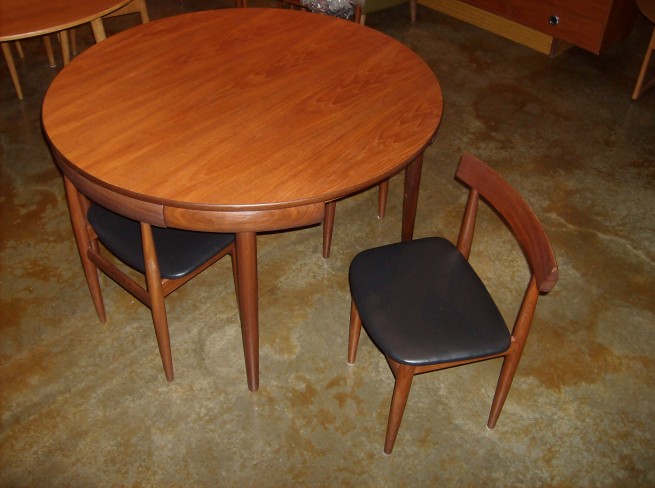 Iconic Danish modern dining table with 4 chairs designed by Hans Olsen for Frem Rojle – this is the 4 legged chair version – this version is much harder to find… the table is a 47″ round where as the 3 legged chair version has a 42″ round top -the table top has been refinished and looks stunning – the chair seats have been refoamed and upholstered – one chair leg has a repair on it…. otherwise gorgeous condition – $1,950