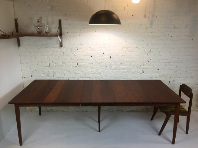 Absolutely Stunning Mid-century Modern solid African teak dining table Designed by Jan Kuypers for Imperial Furniture - Toronto, Canada - use it as a compact size table with no leaves or use one leaf for 6 or 2 for 8 or 3 leaves to seat 10 - notice the center leg structure for full expansion - newly refinished - this incredible table measures - 36" x 40" x 29.25"H - fully extended - 96.75"L -(SOLD)
