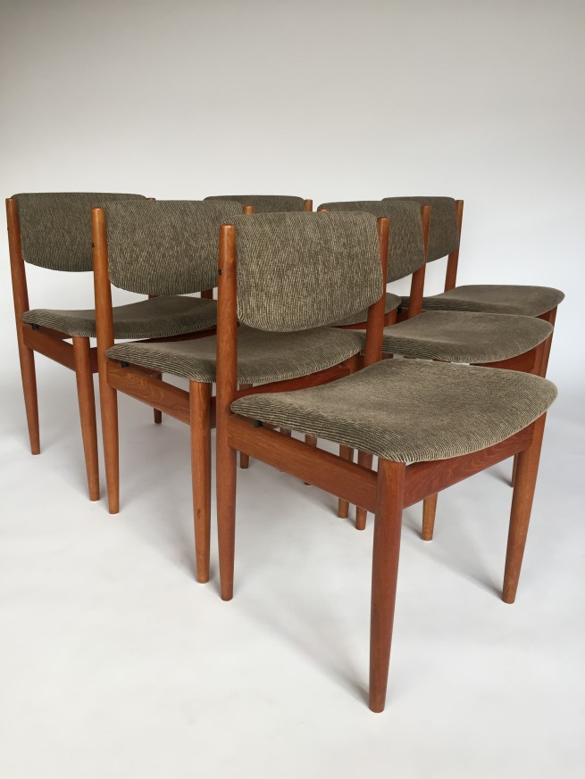 A Spectacular Set of 6 Danish Mid-century Modern dining chairs by Finn Juhl for France and Son - constructed of solid teak - the quality of these chairs is what is to be expected from the combo of this legendary designer and manufacturer. This design is very minimalistic and linear, the subtle details such as the floating seat supported by metal posts. and a slightly curved backrest for support - recently re-upholstered - $3000