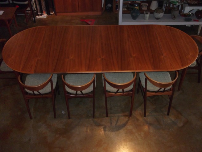 Outstanding and incredibly well made Danish modern teak dining table - incredibly versatile - made in Denmark shown with all 4 leaves - this beauty has been professionally restored - will seat 10 comfortably - measures -49" x 49" x 28.75"H - - each leaf measures - 19.75" providing a maximum length of 128" - (SOLD)