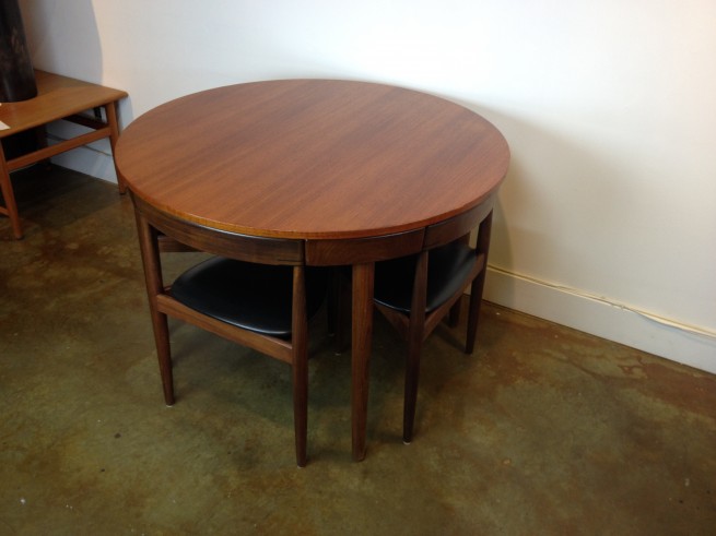 Incredible Mid-century teak dining table & chairs - designed by Hans Olsen for Frem Rojle - Denmark - the 3 legged chairs fit flush with the skirt of the table making for an incredibly compact suite - perfect for small spaces - a design marvel for sure - this beauty is in fantastic condition with a newly refinished table top - measures - 42"diameter x 29.25"H - (SOLD)
