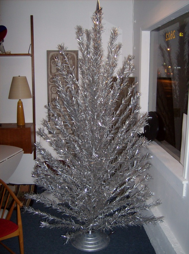 Spectacular 7' Aluminum vintage Christmas tree with a rotating musical base - it also comes with a color wheel - all complete and fabulous - oh yeah, it also comes with it's original box/instructions and separate paper sleeves for every branch -  $350
