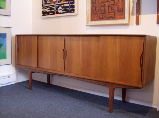 Exquisite Mid-century modern Danish teak credenza - incredibly sculptural - every detail is perfection from the carved handles to the dovetailed front and back drawers on the inside(like nothing you've ever seen) - mind-blowing craftsmanship - excellent condition - gorgeous patina - 78.5"L x 18"D x 33"H - $1200