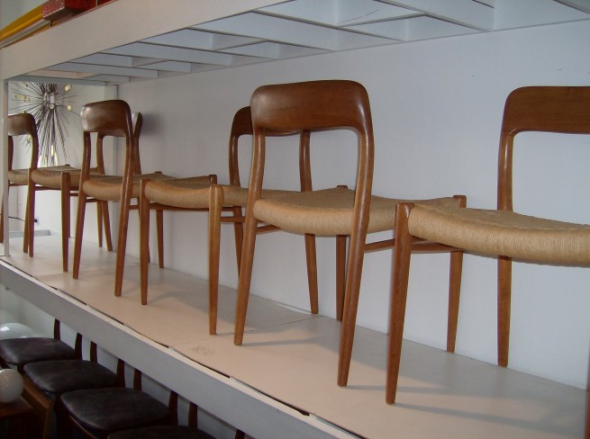 Stunning set of Danish teak dining chairs by designer Niels Moller for J.L.Moller - designed in 1954 - the backrest is sculpted out of solid teak, and then joins and flows into the legs - superbly crafted - the original paper cord seats are all in good vintage condition - one of the chairs however has a repair done where the back rests meets the leg - please ask for additional pics - GORGEOUS - $1800/set of 6