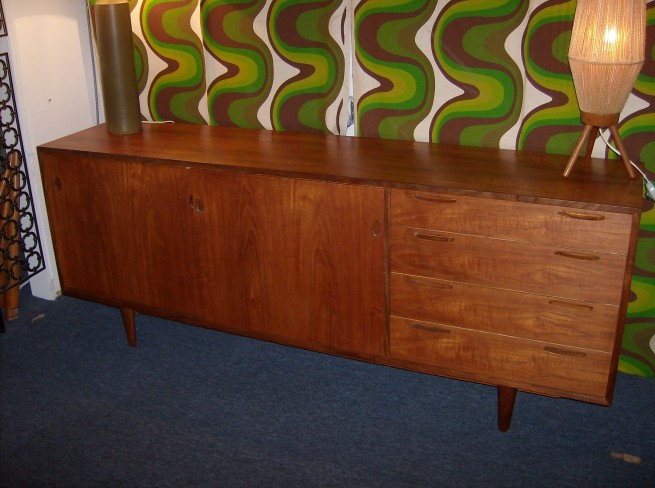 Spectacular Danish teak sideboard - incredible craftsmanship - gorgeous grain - rich patina - professionally refinished top -lots of storage - 2 sliding doors that reveal 1 shelf and the other side has 2 gorgeous drawers, plus 4 handsome dovetailed exposed drawers on the right side - this beauty measures 78 3/4" x 17 3/4"D x 30.5"H - $1200 (SOLD)