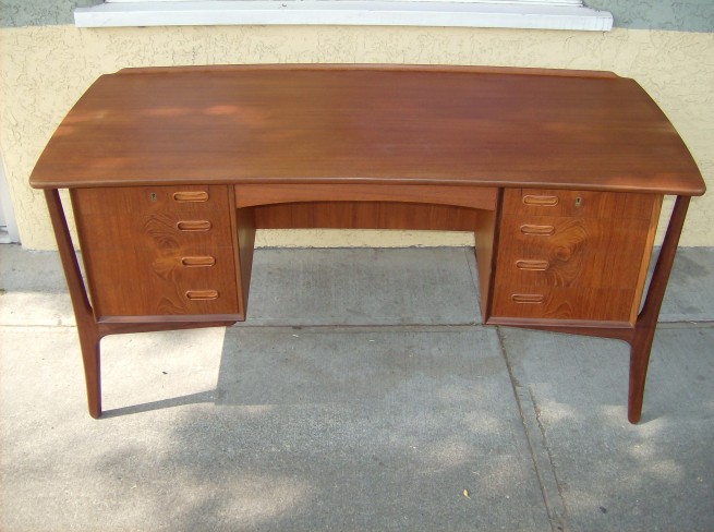 Gorgeous Danish teak desk designed by Architect/designer - Svend Age Madsen - gorgeous patina - 4 drawers on each side - 2 top ones lock(comes with key) back side features a bookshelf and one cupboard - lovely curve and raised lip at the back - WOW (SOLD)