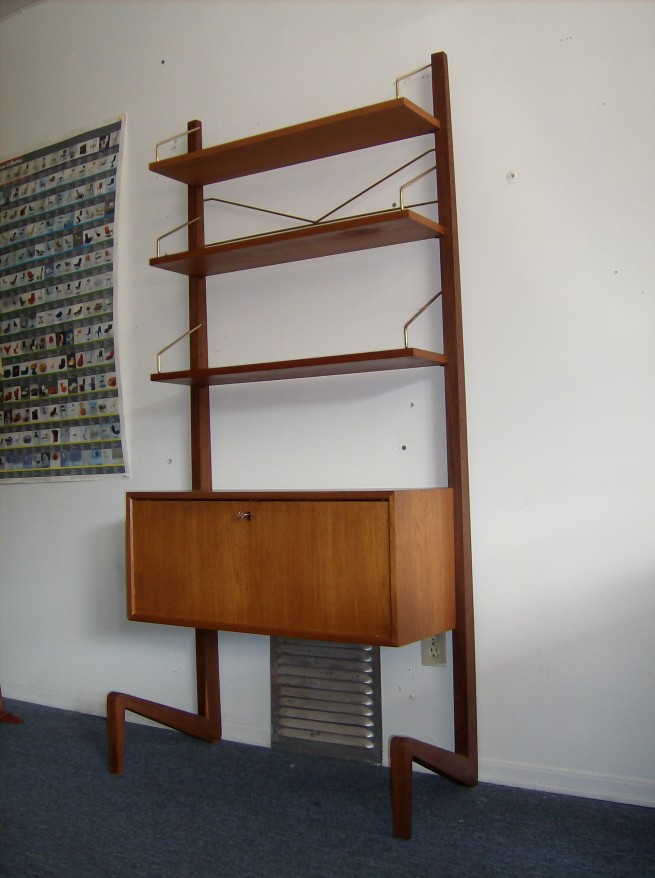 Striking RARE Poul Cadovius free standing wall unit from the 1960's - check out the unique legs - good vintage condition - a fabulous find indeed - measures - 71"H x 16"D (widest point) x 31"L - (SOLD)