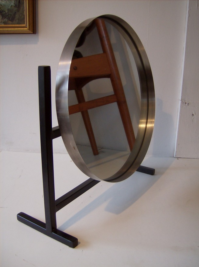 Magnificent 1960's steel mirror with adjustable tilt - manufactured by Durlston Designs Ltd - Surrey, England - very good condition - 17.25"H x 16"L- with a 14"diameter - (SOLD)