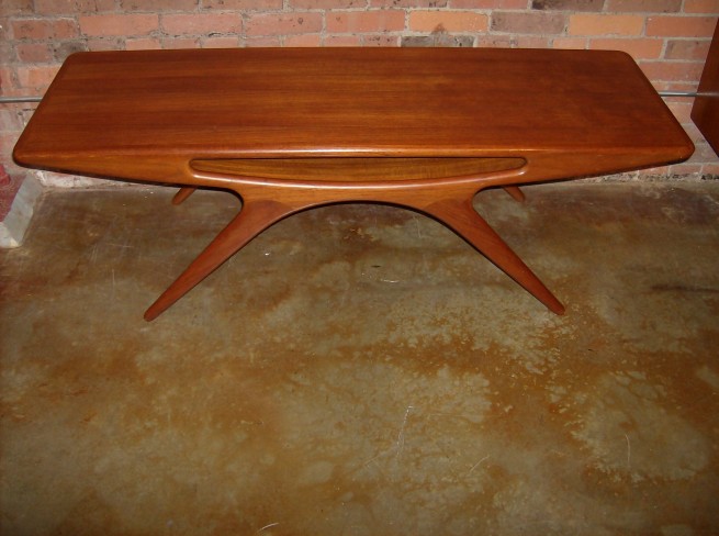 Rare sculptural teak coffee table designed by Johannes Andersen for CFC Silkeborg measures 59″L X 20.5″D X 19.5″ H (SOLD)