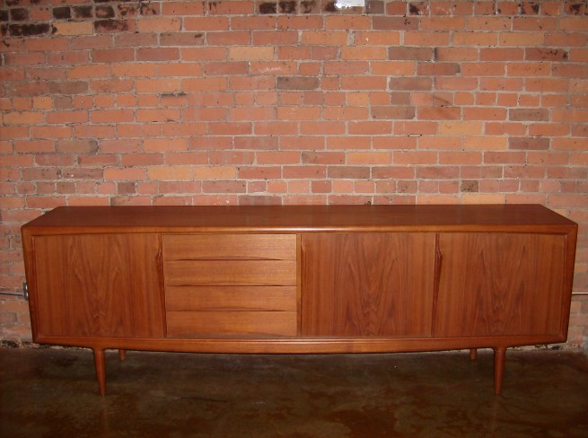 Exceptional Danish  teak sideboard designed by Gunni Omann in the 1960's - a true work of art - Gorgeous - excellent vintage condition - measures 94.5″ L X 31.5 H X 18.5″ D $2,500