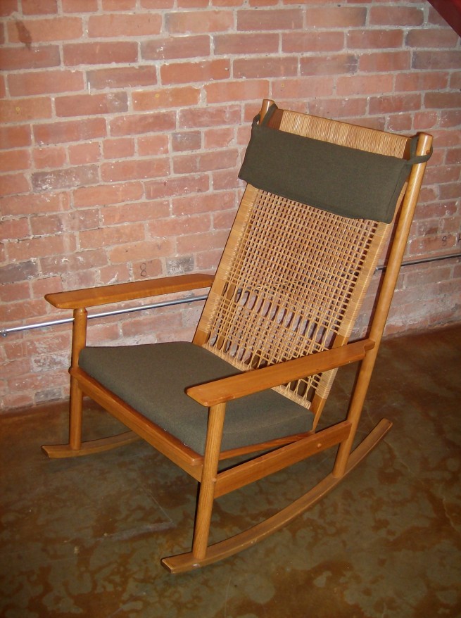 Gorgeous Classic Danish teak rocking chair – designed by Hans Olsen for Bdr Juul Kristiansen/Bramin – design year 1956 – lovely solid teak frame with contrasting woven cane back – newly re-foamed and re-upholstered in a high quality smokey green fabric – $795