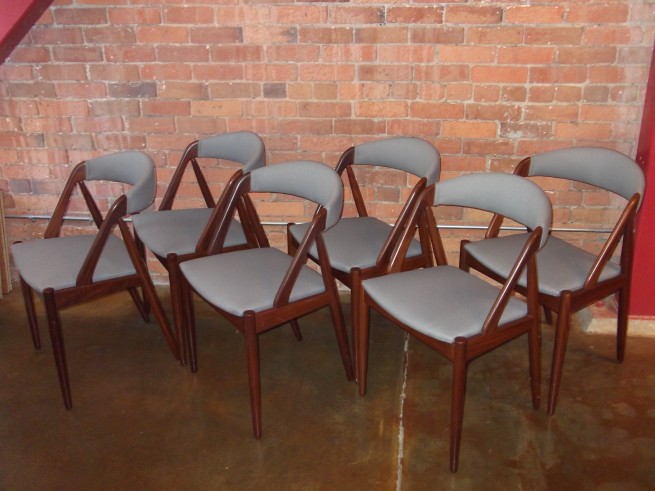 Exceptional and super sexy set of 6 teak dining chairs designed by Kai Kristiansen – Denmark – design year 1956 – model #31 – professionally reupholstered in a gorgeous high quality light grey fabric – these chairs are incredibly comfortable – they have it all – $2200/set